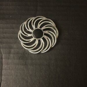 Vintage silver and black woman’s pin